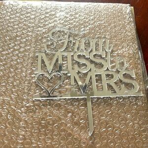 “From Miss to Mrs” cake topper